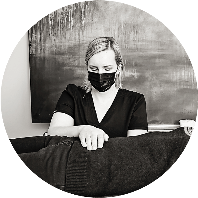 manual osteopathic therapist treats client with hands on technique